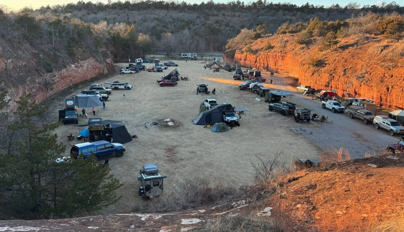 Rigs camped below canyon walls